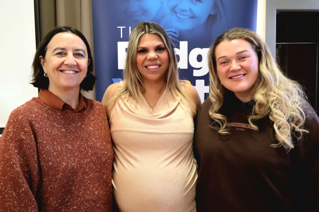 Three women standing together